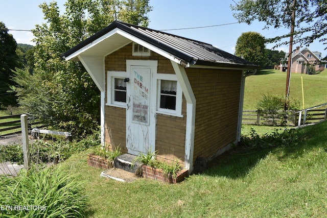 view of shed with fence