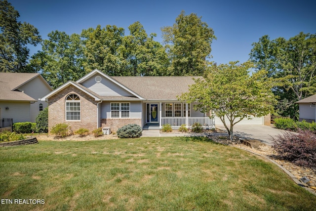 ranch-style home featuring an attached garage, covered porch, brick siding, concrete driveway, and a front lawn