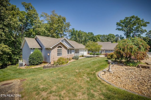 view of front of house featuring central AC and a front yard