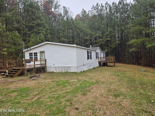 exterior space with a lawn and a deck