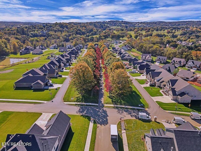 birds eye view of property with a residential view