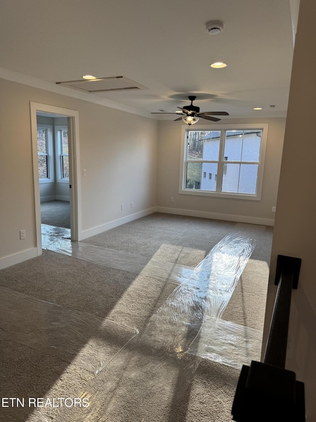 unfurnished room featuring carpet floors and ceiling fan