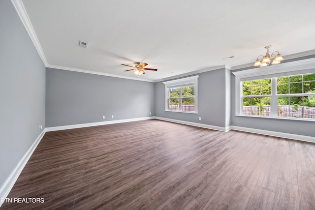 unfurnished living room with ceiling fan with notable chandelier, dark hardwood / wood-style floors, and ornamental molding