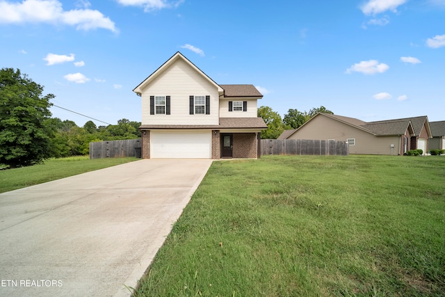 front facade featuring a garage and a front yard