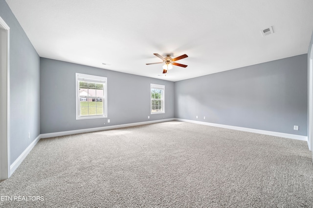 carpeted empty room with ceiling fan