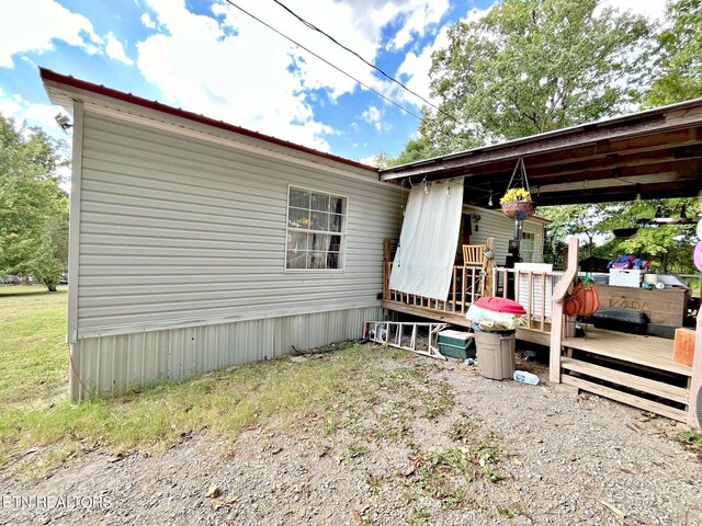 view of property exterior featuring a deck