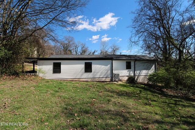 view of outbuilding featuring a yard