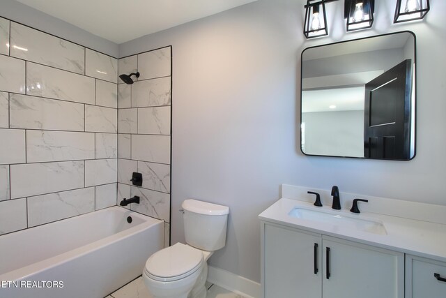 full bathroom with toilet, tiled shower / bath combo, vanity, and tile patterned floors