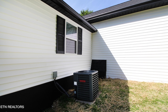 details with cooling unit and roof with shingles