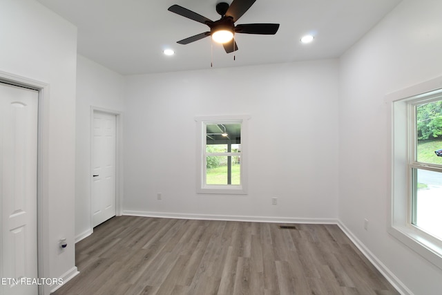 unfurnished bedroom featuring recessed lighting, baseboards, and wood finished floors