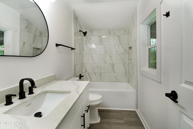 full bathroom with toilet, vanity, wood finished floors, and shower / bathing tub combination