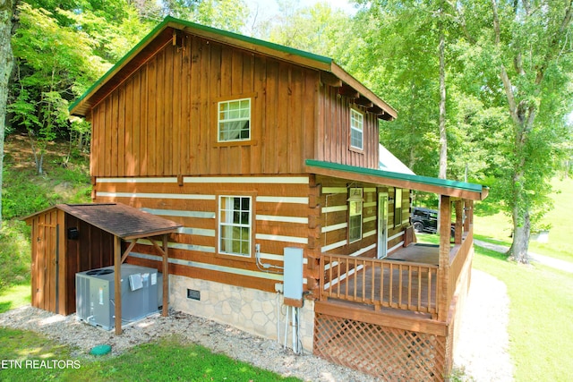 view of property exterior with central AC and a deck