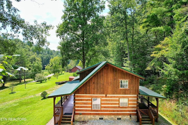 exterior space with a yard and a deck