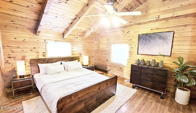 bedroom featuring wood-type flooring, lofted ceiling with beams, wooden walls, and wooden ceiling