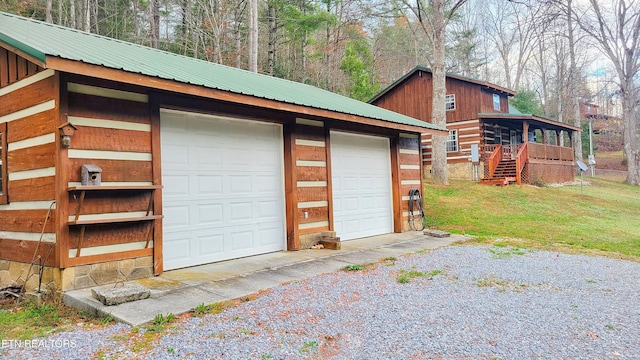 garage with a lawn