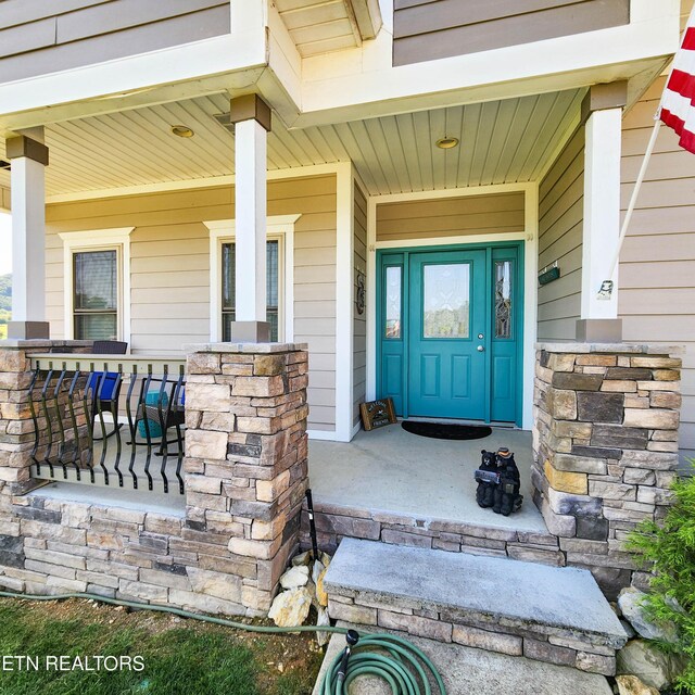 property entrance with a porch