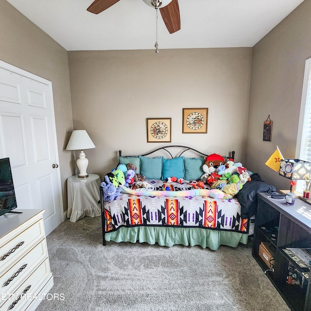 carpeted bedroom featuring ceiling fan