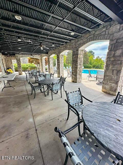 view of patio / terrace featuring a community pool