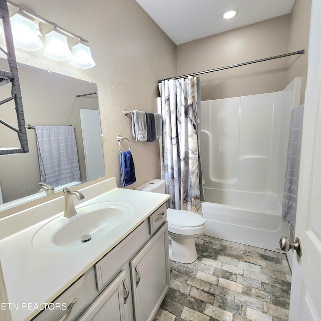 full bathroom featuring vanity, toilet, and shower / bath combo with shower curtain