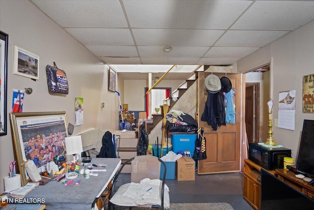 basement featuring a drop ceiling