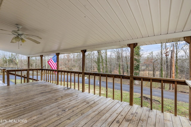 wooden terrace featuring ceiling fan