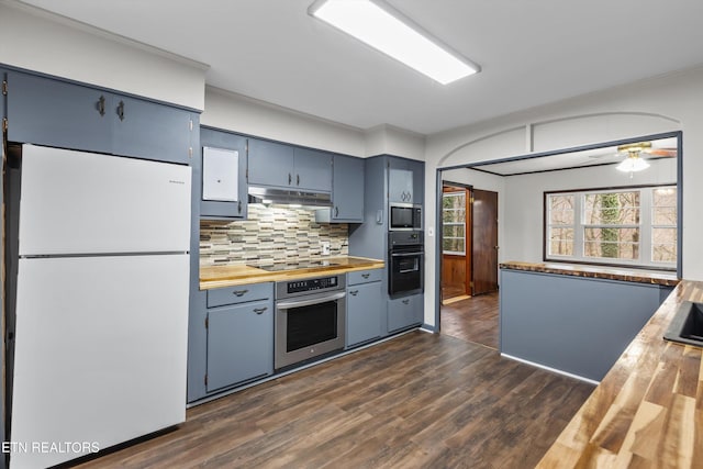 kitchen featuring under cabinet range hood, wooden counters, backsplash, dark wood-style floors, and black appliances