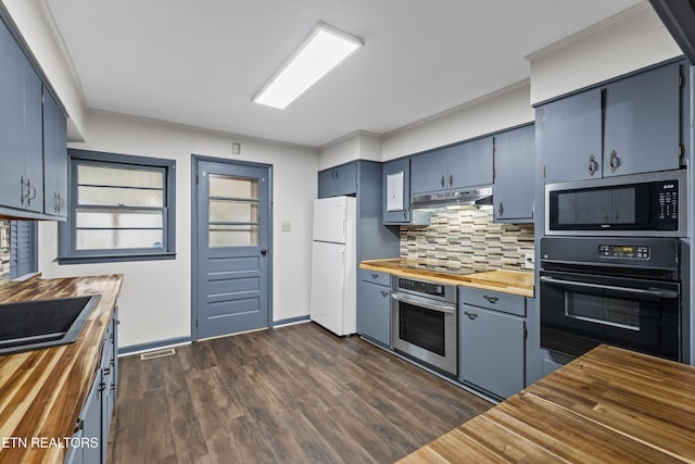 kitchen with dark wood finished floors, wooden counters, under cabinet range hood, and black appliances