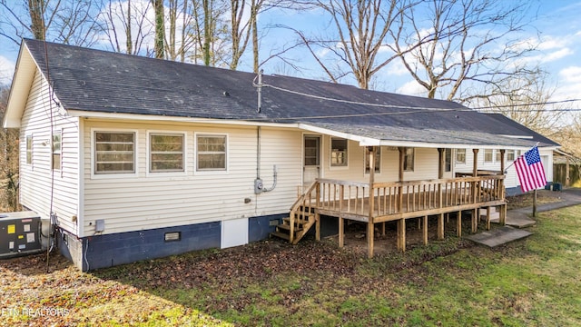 rear view of property with a shingled roof, crawl space, covered porch, and central air condition unit