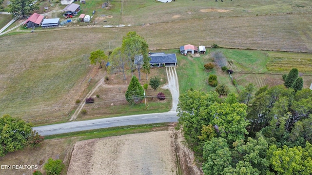 birds eye view of property featuring a rural view