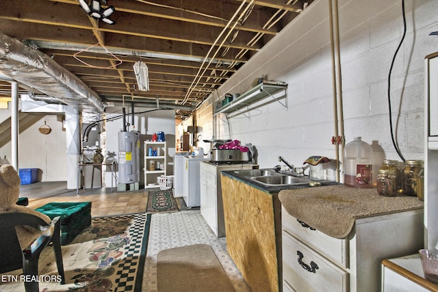 unfinished basement with heating unit, water heater, washer and clothes dryer, and a sink