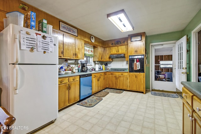 kitchen featuring black appliances and backsplash