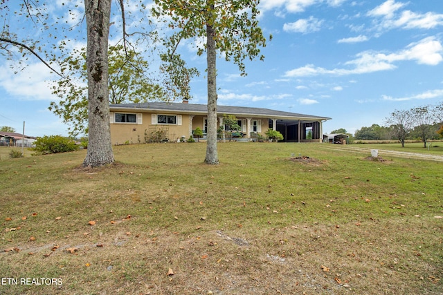 ranch-style home with a front yard