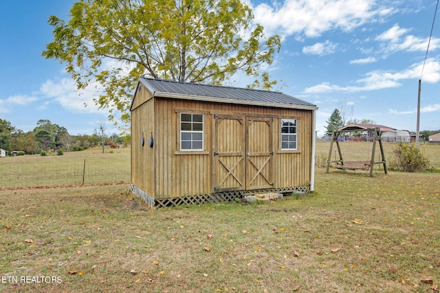 view of outdoor structure featuring a yard