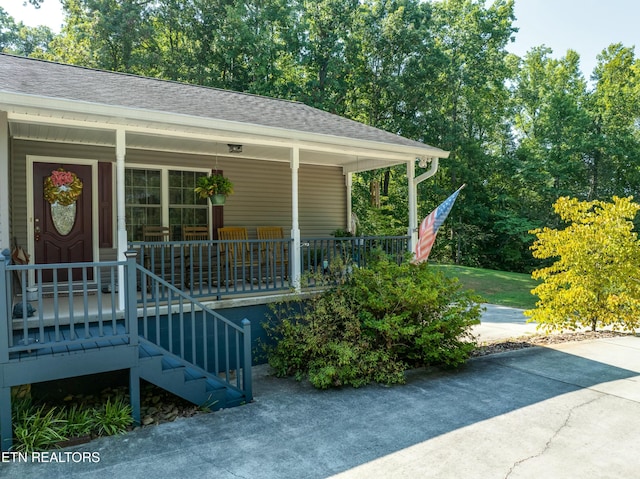 doorway to property with a porch