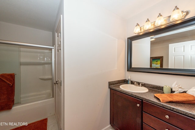 bathroom featuring vanity, tile patterned flooring, and shower / bath combination with glass door