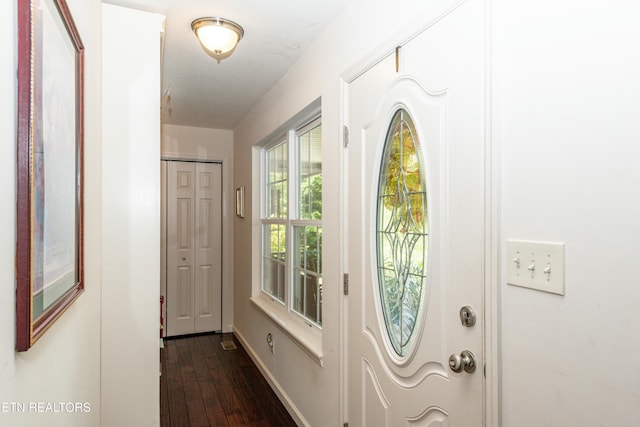 doorway featuring dark hardwood / wood-style floors