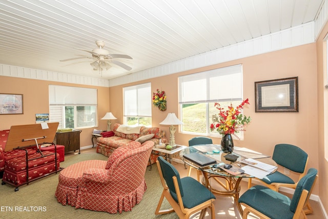 interior space with ceiling fan