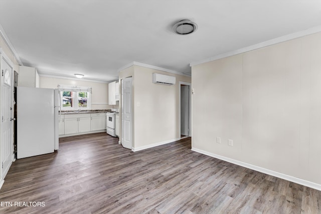 kitchen featuring dark wood-style floors, white appliances, a wall mounted air conditioner, and crown molding