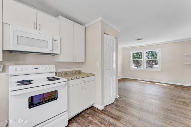 kitchen featuring white appliances, light wood finished floors, baseboards, light countertops, and white cabinetry