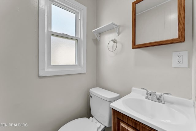 half bath with vanity and toilet