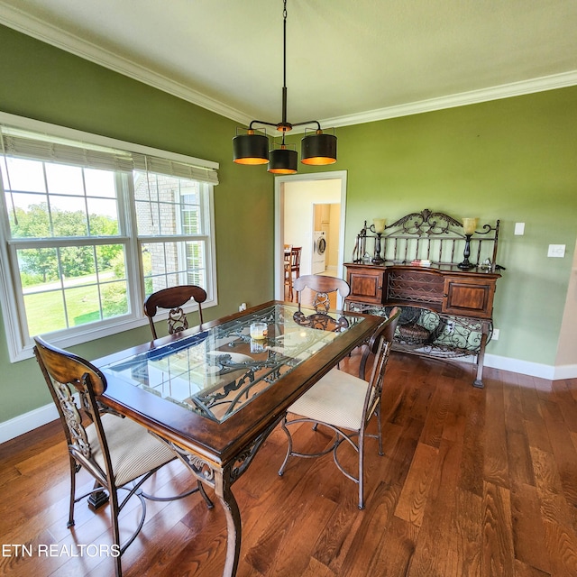 dining room with dark hardwood / wood-style flooring and ornamental molding