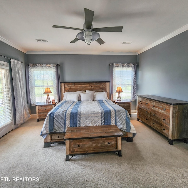 bedroom with ceiling fan, light carpet, and crown molding