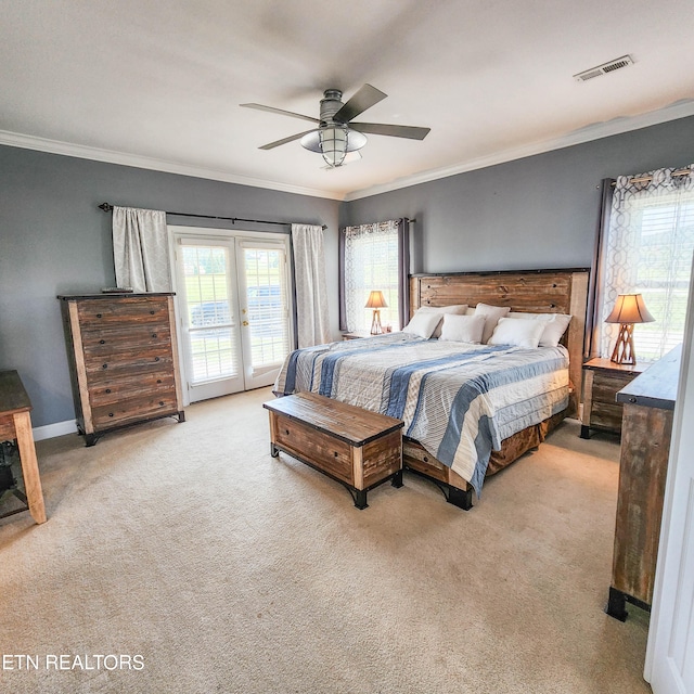 bedroom featuring ornamental molding, french doors, light carpet, access to exterior, and ceiling fan