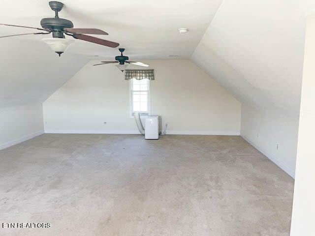 bonus room featuring carpet, lofted ceiling, and ceiling fan