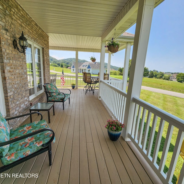 deck featuring a lawn