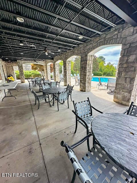 view of patio with a community pool