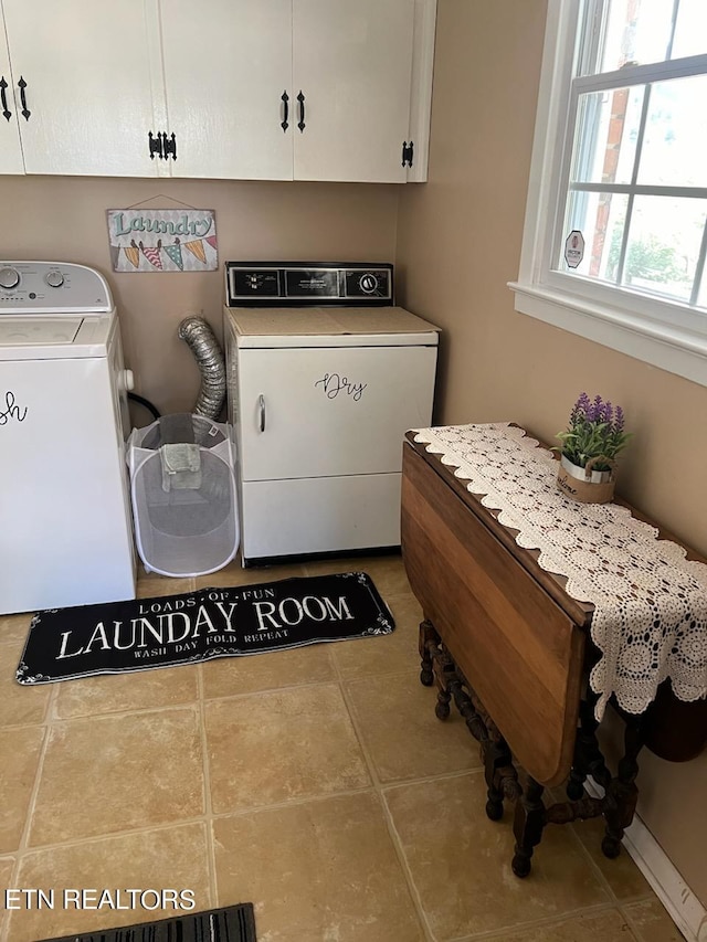 laundry area with washer / clothes dryer, cabinets, and tile patterned floors