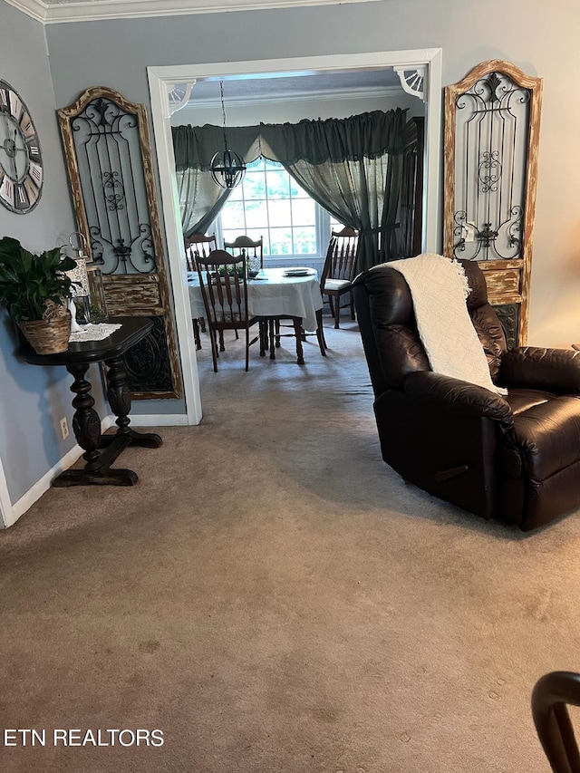 carpeted living room featuring crown molding and a chandelier