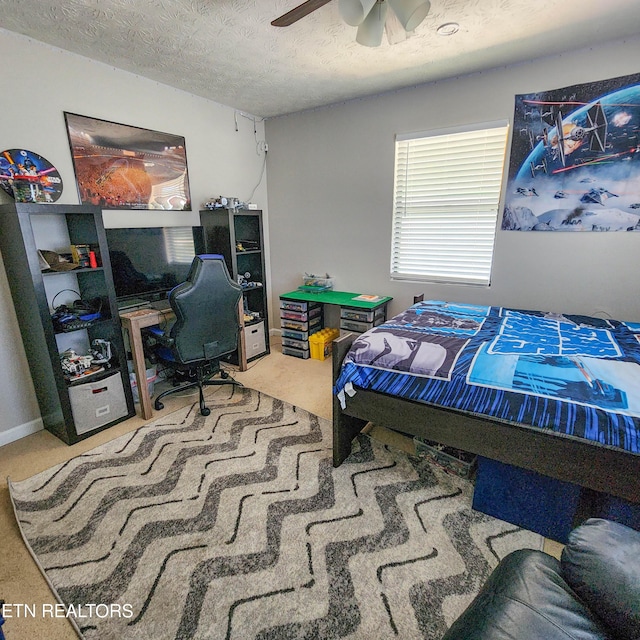 bedroom featuring carpet flooring, ceiling fan, a textured ceiling, and baseboards