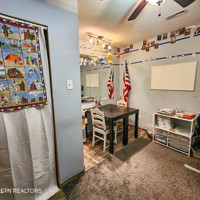 office with a ceiling fan and visible vents